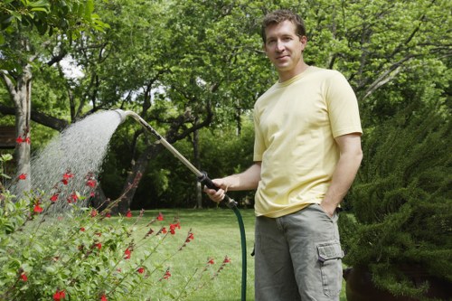 Experts pruning and maintaining Finchley gardens